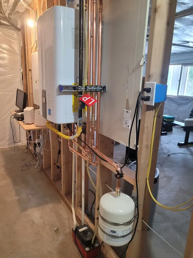 Licensed plumber repairing a kitchen sink in Oberlin